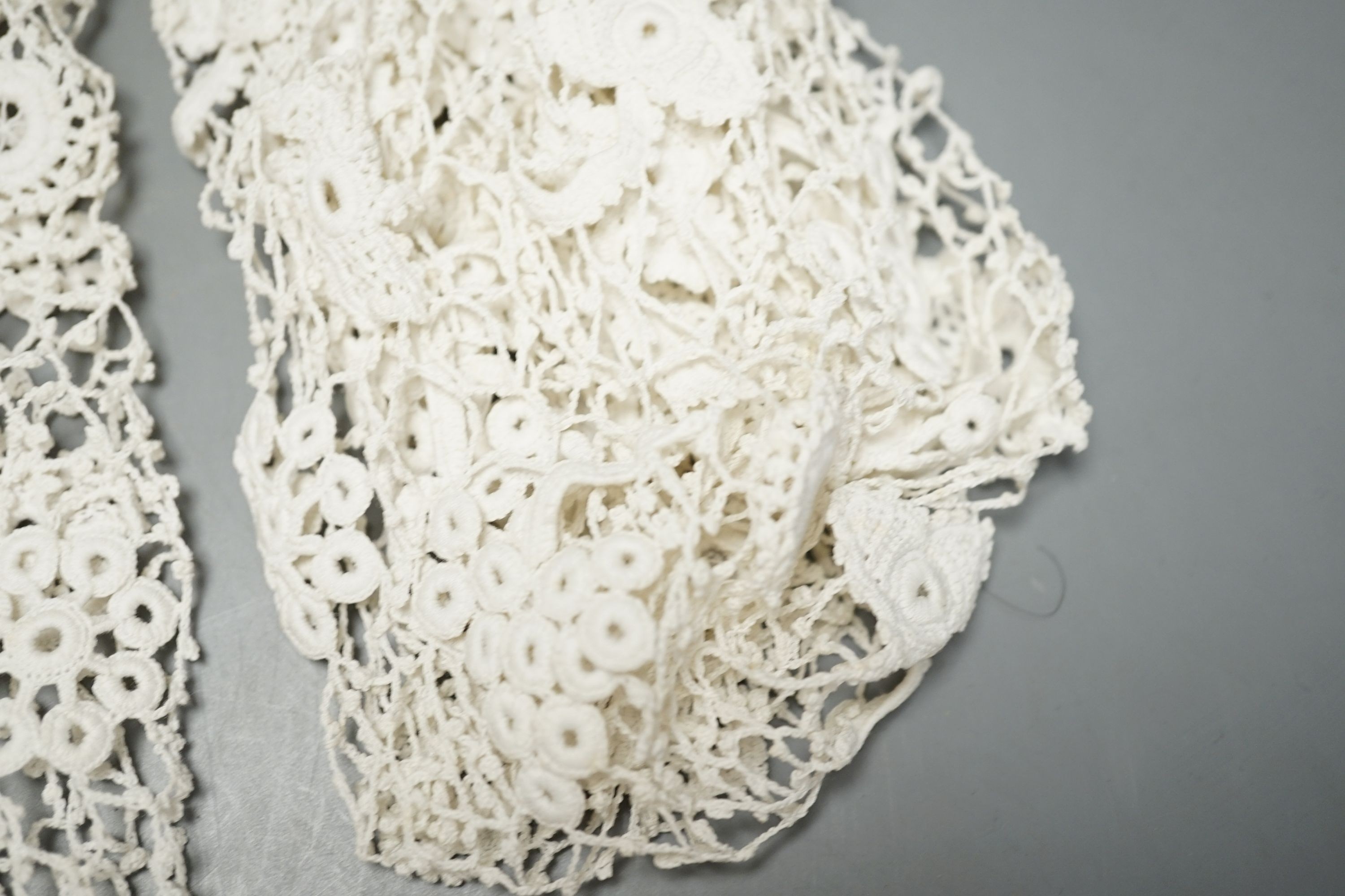 A 19th century hand made Irish crochet jacket, with long sleeves and high collar, a bobbin lace and white worked patch worked blouse, a fine lawn and anglaise worked blouse and a fine bobbin lace trimmed and white worked